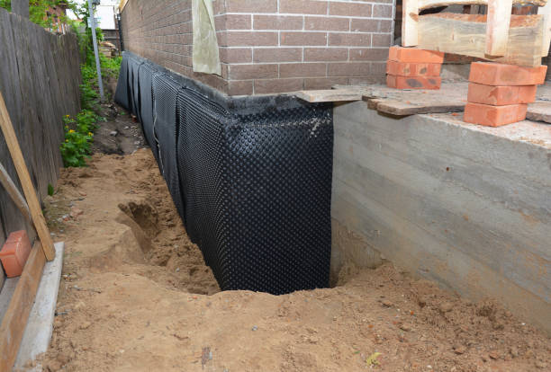 SJ Waterproofing Pros technician performing targeted Waterproofing assessment in Sylvania, AL